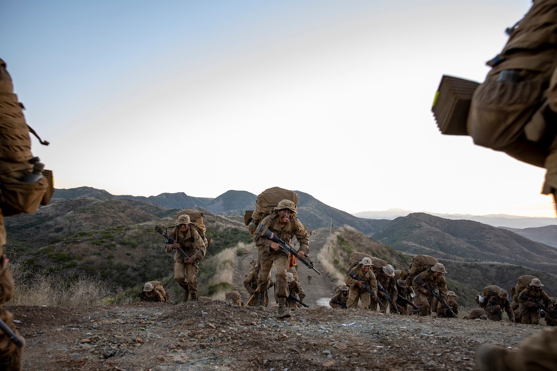 U.S. Marine Corps recruits with Charlie Company, 1st Recruit Training Battalion, hike up the "Reaper" during the final portion of the crucible on Marine Corps Base Camp Pendleton, Calif., Aug. 23, 2023. The Crucible is a 54-hour exercise where recruits apply the knowledge they have learned throughout recruit training, to earn the title of United States Marines. (U.S. Marine Corps photo by Sgt.  Guyette)