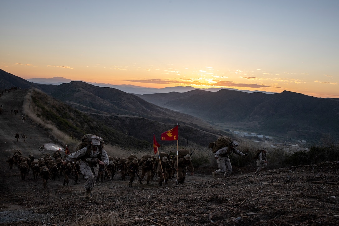U.S. Marine Corps recruits with Charlie Company, 1st Recruit Training Battalion, hike up the "Reaper" during the final portion of the crucible on Marine Corps Base Camp Pendleton, Calif., Aug. 23, 2023. The Crucible is a 54-hour exercise where recruits apply the knowledge they have learned throughout recruit training, to earn the title of United States Marines. (U.S. Marine Corps photo by Sgt. Guyette)