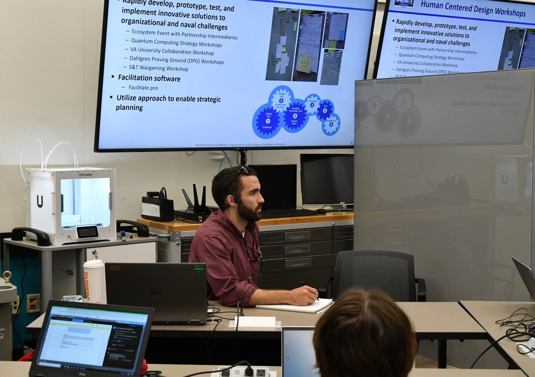 IMAGE: Tristan Anderson, an intern in the Integrated Engagement Systems Department at Naval Surface Warfare Center Dahlgren Division (NSWCDD), focuses on his assignment during the Modeling and Simulation Toolbox Summer Hackathon at NSWCDD’s Innovation Lab July 19.