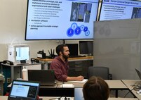IMAGE: Tristan Anderson, an intern in the Integrated Engagement Systems Department at Naval Surface Warfare Center Dahlgren Division (NSWCDD), focuses on his assignment during the Modeling and Simulation Toolbox Summer Hackathon at NSWCDD’s Innovation Lab July 19.