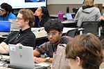 IMAGE: Prem Gandhi, an intern in the Weapons Control and Integration Department at Naval Surface Warfare Center Dahlgren Division (NSWCDD), concentrates during the Modeling and Simulation Toolbox Summer Hackathon July 19 in NSWCDD’s iLab.