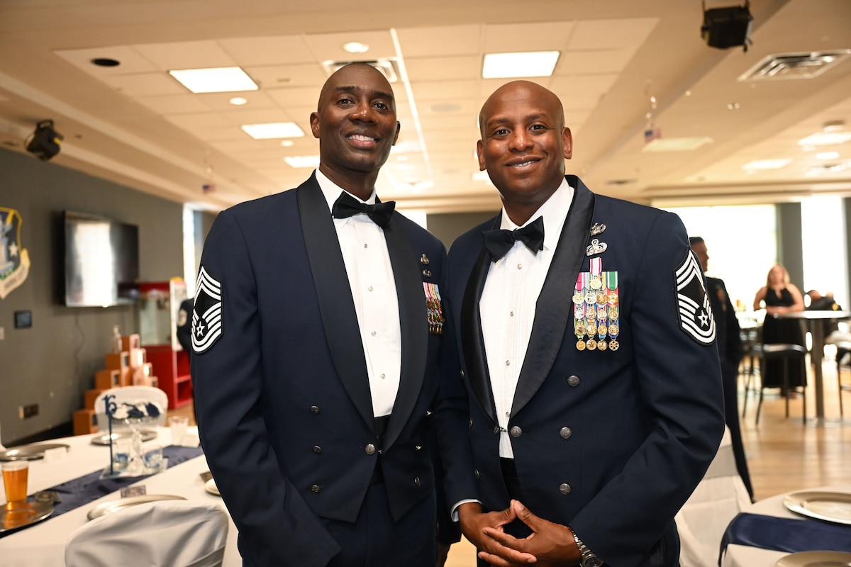 U.S. Air Force Chief Master Sgt. Hamp Lee III, Program Manager for Air Force Handbook 1, Airman, and Chief Master Sgt. Derrick Sherrod, 17th Mission Support Group senior enlisted leader, attend the 17th Training Wing Senior Noncommissioned Officer Induction Ceremony at the Powell Event Center, Goodfellow Air Force Base, Texas, Aug. 18, 2023. The tradition of the induction ceremony is a passage used by SNCOs to convey to newly promoted sergeants the special pride and sense of esteem felt when a young service member enters the SNCO corps. (U.S. Air Force photo by Airman 1st Class Evelyn D’Errico)