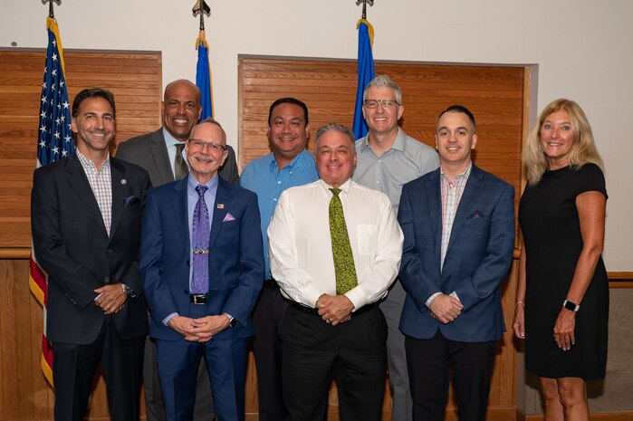 Honorary commander inductees gather for a group photo at Nellis Air Force Base, Nevada, Aug. 18, 2023. The honorary commander program creates opportunities to educate key community members about the missions of Nellis. (U.S. Air Force photo by Airman 1st Class Jordan McCoy)