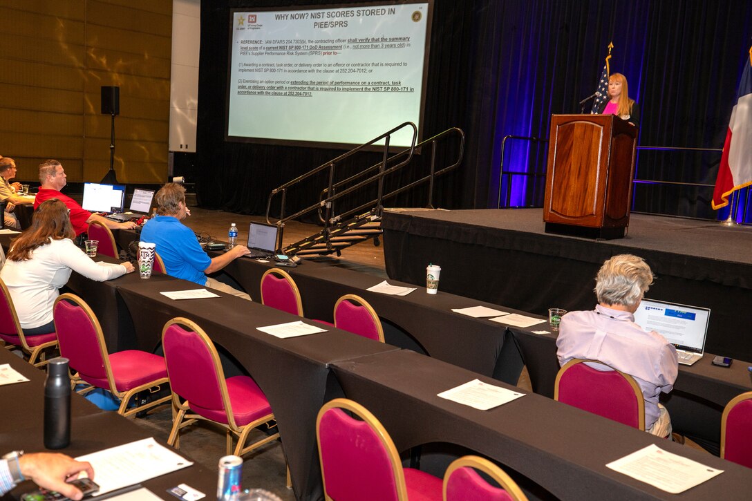 Amanda Zawieruszynski, Procurement Analyst, U.S. Army Corps of Engineers (USACE), Southwestern Division (SWD), speaks about “Cyber Security National Institute of Standards and Technology (NIST) Scores” at the USACE, Galveston District semi-annual Stakeholder Partnering Forum with non-federal sponsors, customers and agency partners at the Moody Gardens Convention Center in Galveston, Texas, Aug. 22, 2023.