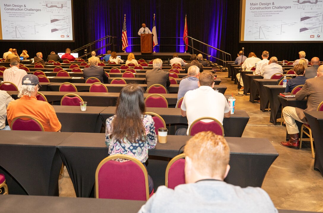 Carlos Tate, U.S. Army Corps of Engineers (USACE), Galveston District, Programs and Project Management Division, project manager, speaks about the “Houston Ship Channel (HSC) Segment 3 Project” at the Galveston District semi-annual Stakeholder Partnering Forum with non-federal sponsors, customers and agency partners at the Moody Gardens Convention Center in Galveston, Texas, Aug. 22, 2023.