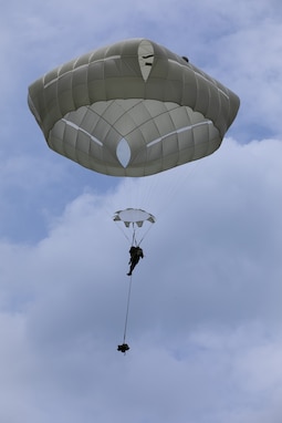A student of the Royal Thai Army conducts an airborne jump during one of the four required airborne operations to graduate from the first Royal Thai Army all-female Basic Airborne Course conducted by the RTA Special Warfare School at Camp Erawan, Lop Buri, Thailand, Aug. 8, 2023. Nearly 100 female RTA soldiers from Airborne Class 345 earned their Parachutist Badge after completing four weeks of rigorous training to include four static line jumps, one with combat equipment and one at night. The course concluded with an 8k ruck march from the drop zone. The U.S. also participated in the historic jump by serving as airborne-qualified mentors. Our continued, face-to-face exchanges with our allies and partners are a foundation of a our bilateral relationships, and bolster understanding in the region that we are going to be a reliable partner in both good and bad times. (U.S. Army Photo by Cpl. P.J. Siquig)