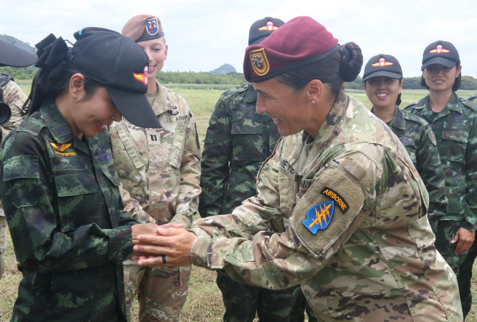 Royal Thai Army Capt. Napason Kingyong receives U.S. Master Parachutist Jump Wings from 1st Sgt. Sarah Meyers, U.S. Army Forward Support Company, 1st Battalion, 1st Special Forces Group (Airborne), who served as a U.S. Army Special Operations Forces jumpmaster mentor during the Royal Thai Army first all-female Basic Airborne Course conducted by the RTA Special Warfare School at Camp Erawan, Lop Buri, Thailand, 9, 2023. The United States and Thailand have nearly two centuries of diplomatic relations and have been security treaty allies for over 66 years. Our continued, face-to-face exchanges with our allies and partners are a foundation of a our bilateral relationships, and bolster understanding in the region that we are going to be a reliable partner in both good and bad times. (U.S. Air Force photo by Master Sgt. Theanne Tangen)