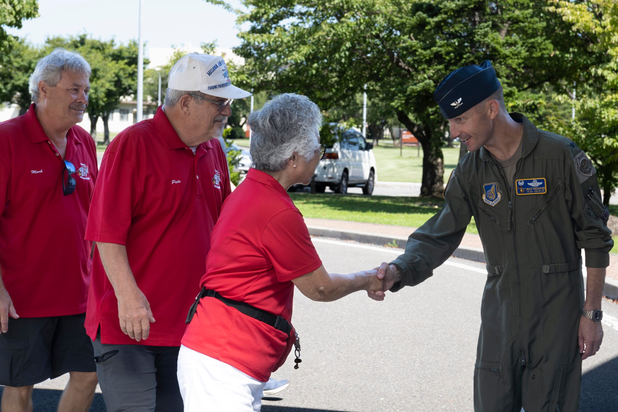 U.S. Air Force Col. Michael Richard, 35th Fighter Wing commander, greets delegates from Wenatchee Valley, Washington.