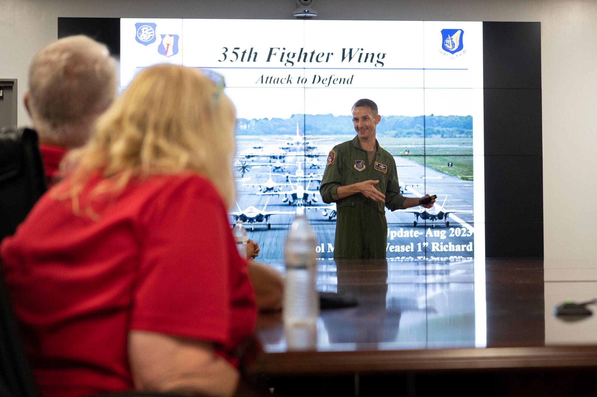 U.S. Air Force Col. Michael Richard, 35th Fighter Wing commander, gives a presentation to a group of delegates from Wetatchee Valley, Washington.