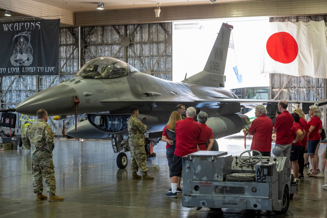 Sister city delegates receive a brief about the role of the F-16 Fighting Falcon.