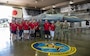 Sister city delegates pose with 35th Fighter Wing leadership in front of an F-16