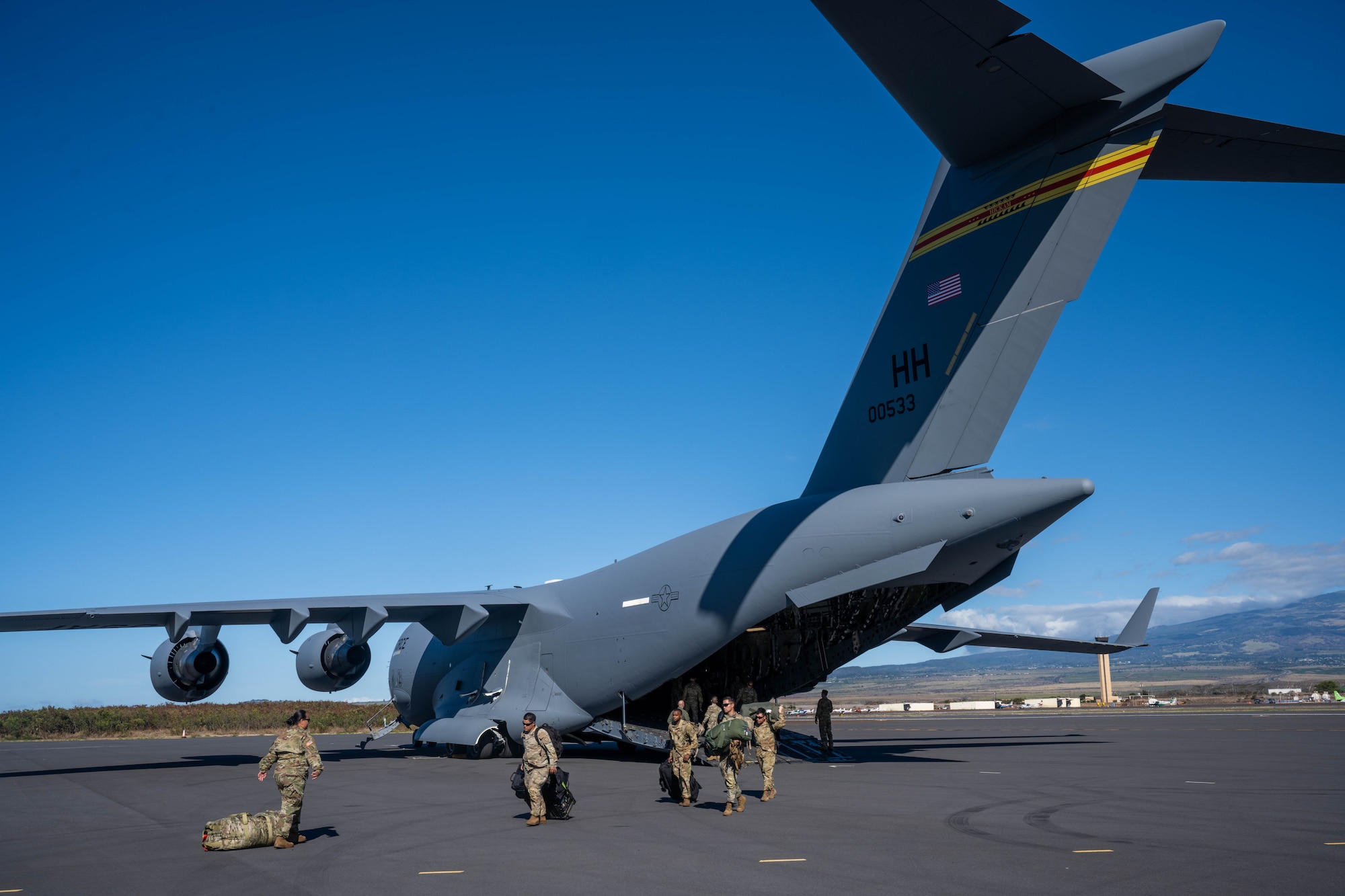 U.S. Army Soldiers assigned to the 524th Division Sustainment Support Battalion arrive on the Island of Maui in support of Joint Task Force 50, August 19, 2023. Members from the 535th Airlift Squadron transported personnel and equipment from the U.S. Army in support of Joint Task Force 50 to provide humanitarian aid and assistance and offer continued support to the communities impacted by the wildfires. (U.S. Air Force photo by Senior Airman Makensie Cooper)