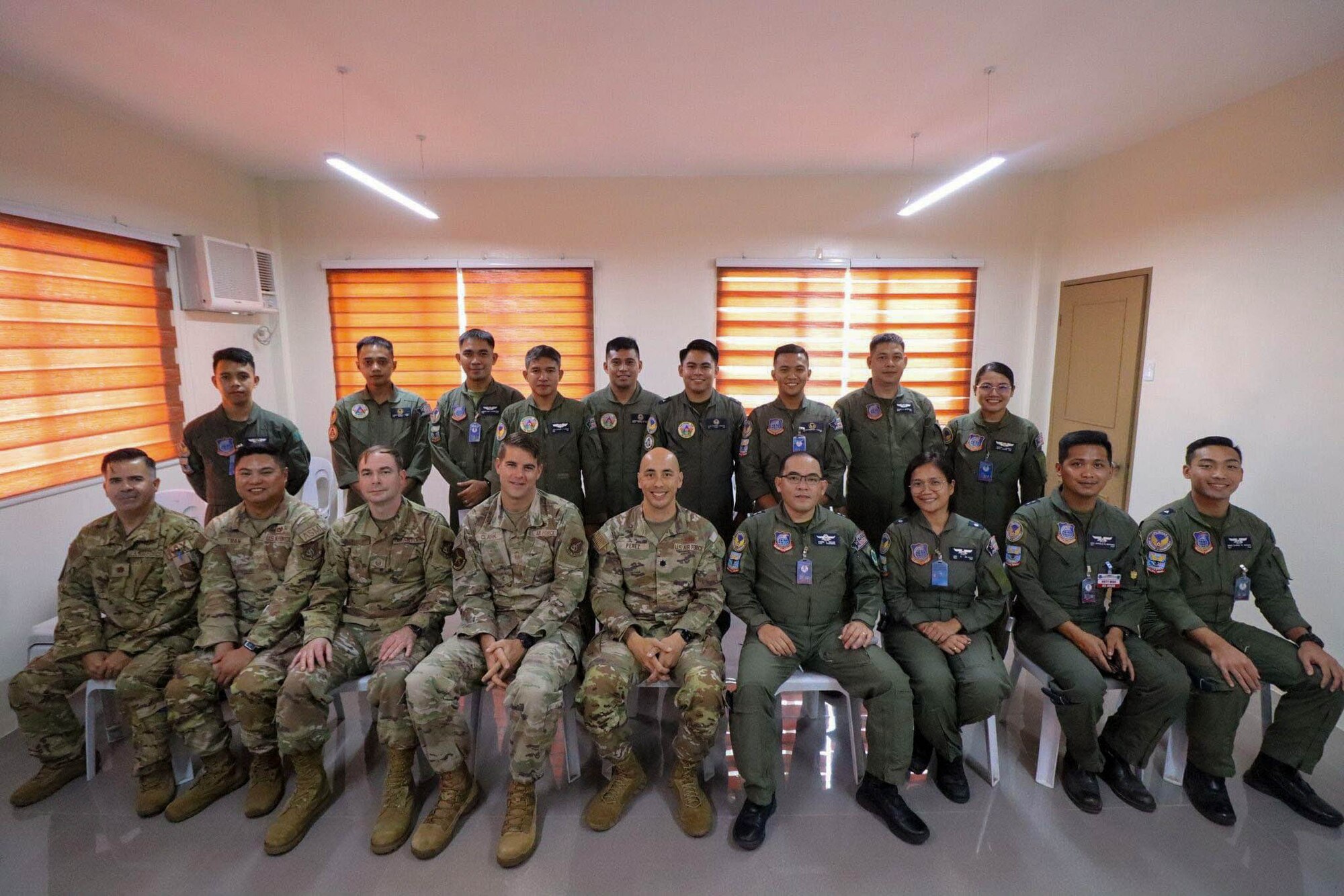 Leaders from the 374th Maintenance Group sit for a group photo alongside members of the Philippine Air Force.