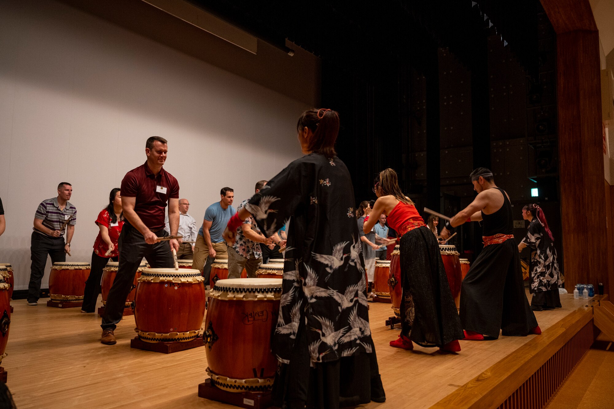 Commanders and senior enlisted leaders assigned to the 35th Fighter Wing play traditional Japanese taiko drums during a team building event at the Misawa International Center.