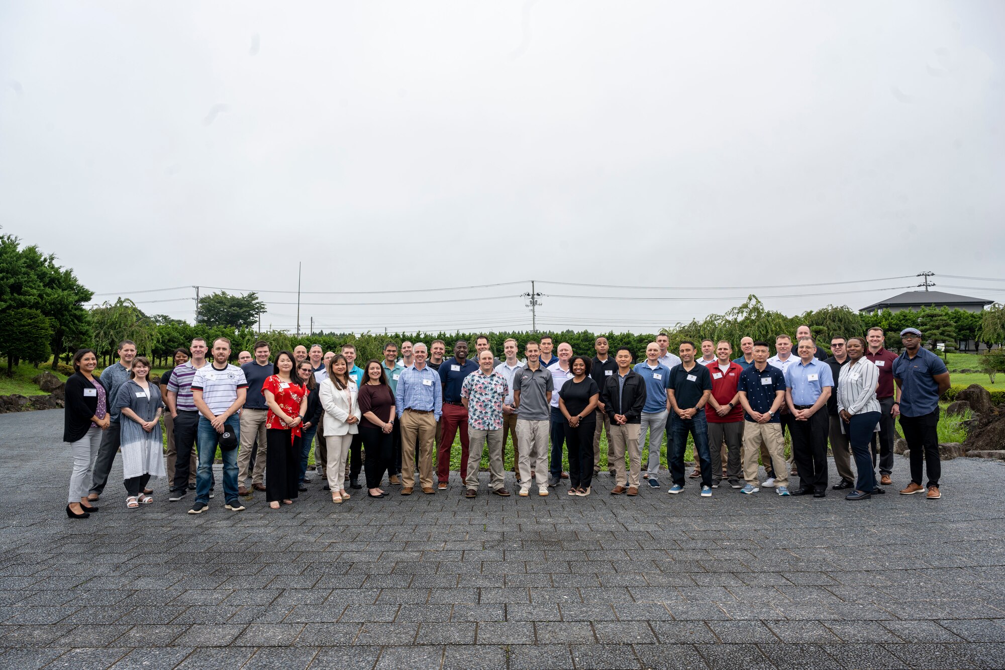 Commanders and senior enlisted leaders assigned to the 35th Fighter Wing pose together during a team building event at the Misawa International Center.