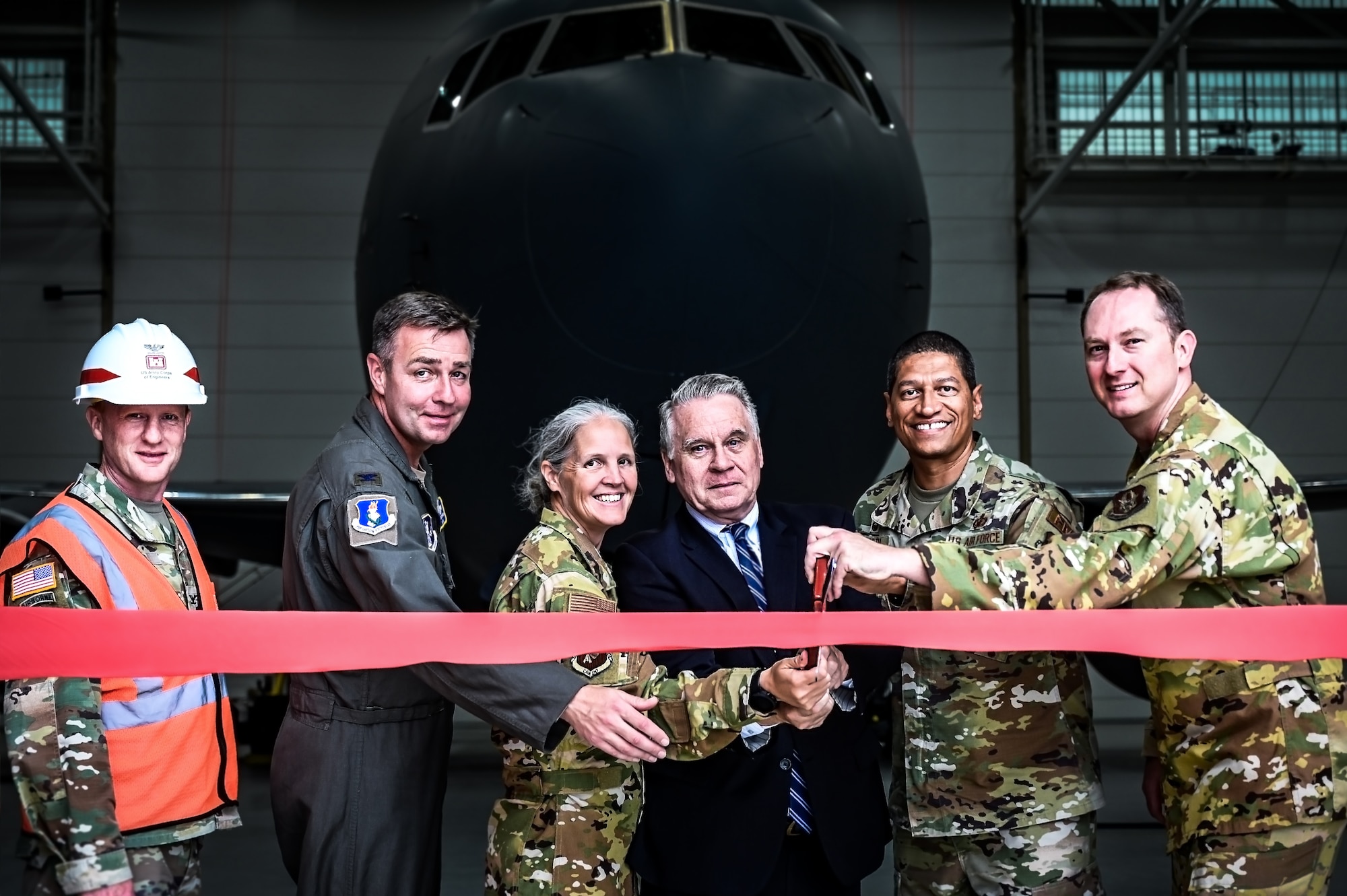 Joint Base Leadership and personnel attend a ribbon cutting ceremony for the opening of the 305th Air Mobility Wing’s Dock 46 Two-Bay Hangar at Joint Base McGuire-Dix-Lakehurst, N.J. on 24 Aug. 2023. New Jersey 4th District Congressman Chris Smith addressed the audience on the strategic value the facility brings to the KC-46A Pegasus refueling mission. The event concludes four and a half years of planning and 240,650 accident-free man-hours after its initial groundbreaking on December 3, 2018. A military construction project valued at nearly $54 million, the hangar will serve as a mission-critical asset in the KC-46A Pegasus' ability to provide Rapid Global Mobility for the Joint Force.