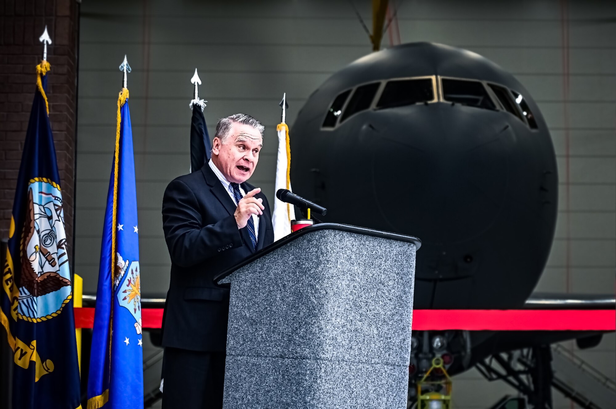 Joint Base Leadership and personnel attend a ribbon cutting ceremony for the opening of the 305th Air Mobility Wing’s Dock 46 Two-Bay Hangar at Joint Base McGuire-Dix-Lakehurst, N.J. on 24 Aug. 2023. New Jersey 4th District Congressman Chris Smith addressed the audience on the strategic value the facility brings to the KC-46A Pegasus refueling mission. The event concludes four and a half years of planning and 240,650 accident-free man-hours after its initial groundbreaking on December 3, 2018. A military construction project valued at nearly $54 million, the hangar will serve as a mission-critical asset in the KC-46A Pegasus' ability to provide Rapid Global Mobility for the Joint Force.