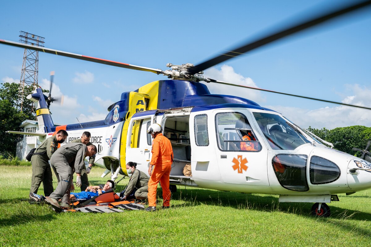 Philippine Air Force medics prepare a simulated post-disaster priority care patient for rapid airlift transportation during Pacific Airlift Rally 2023 at Clark Air Base, Philippines, Aug. 16, 2023. Training, education, and exchange programs between the U.S. Air and Space forces and their global partners provide mutually beneficial learning opportunities and promote long-term partnerships between international military leaders and servicemembers. (U.S. Air Force photo by Senior Airman Jordan Smith)
