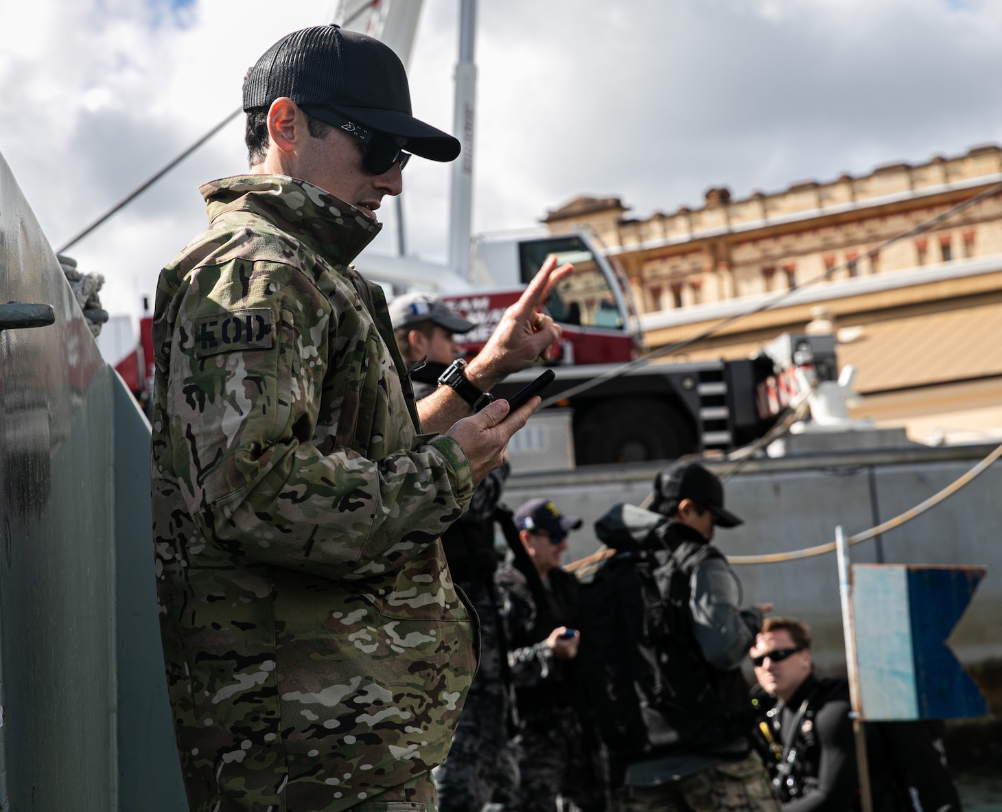 Lt. Jamison Ware, assigned to Explosive Ordnance Disposal Mobile Unit 5, Platoon 522, signals for divers leaving surface in Sydney, Australia, during Exercise Malabar 2023, August 15. This iteration of Malabar is the first year with Australia as the host country. Malabar 23 is a surface, air, and subsurface multilateral field training exercise conducted with the Royal Australian Navy, Indian Navy, Japan Maritime Self-Defense Force, and U.S. Navy that enhances interoperability and strengthens ties and critical partnerships between the maritime forces and demonstrates the countries commitment to the Indo-Pacific region.
