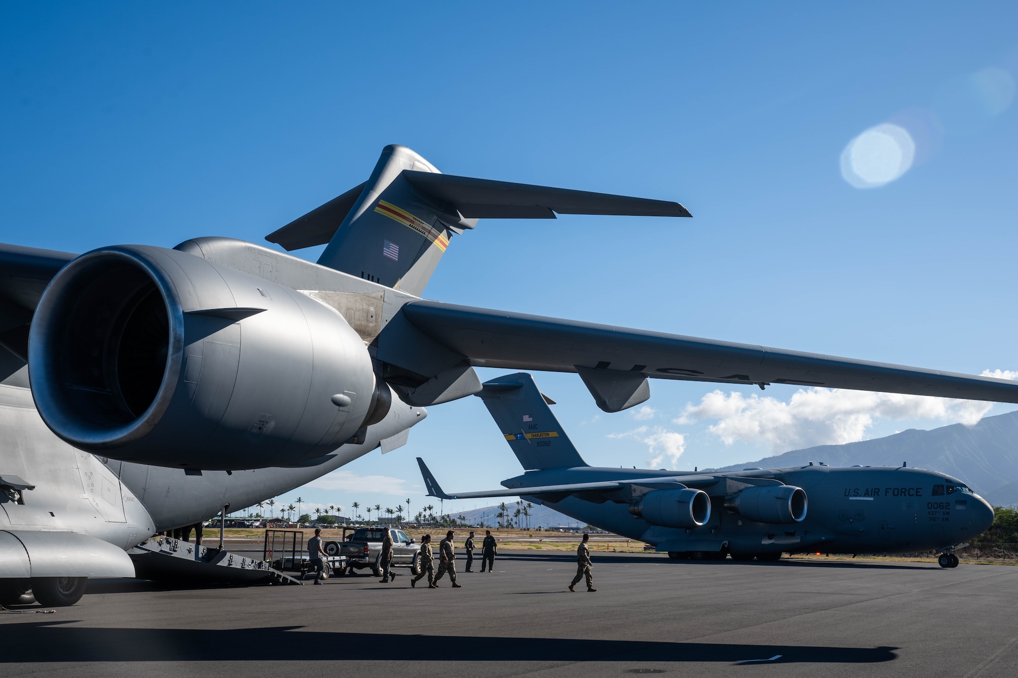 U.S. Army Soldiers assigned to the 524th Division Sustainment Support Battalion arrive on the Island of Maui in support of the Joint Task Force 50 at Kahului Airport, Maui, Hawaii, August 19, 2023. Members from the 535th Airlift Squadron transported U.S. Soldiers to the island of Maui to help those impacted by the wildfires and to provide aid and disaster relief to the impacted communities. (U.S. Air Force photo by Senior Airman Makensie Cooper)