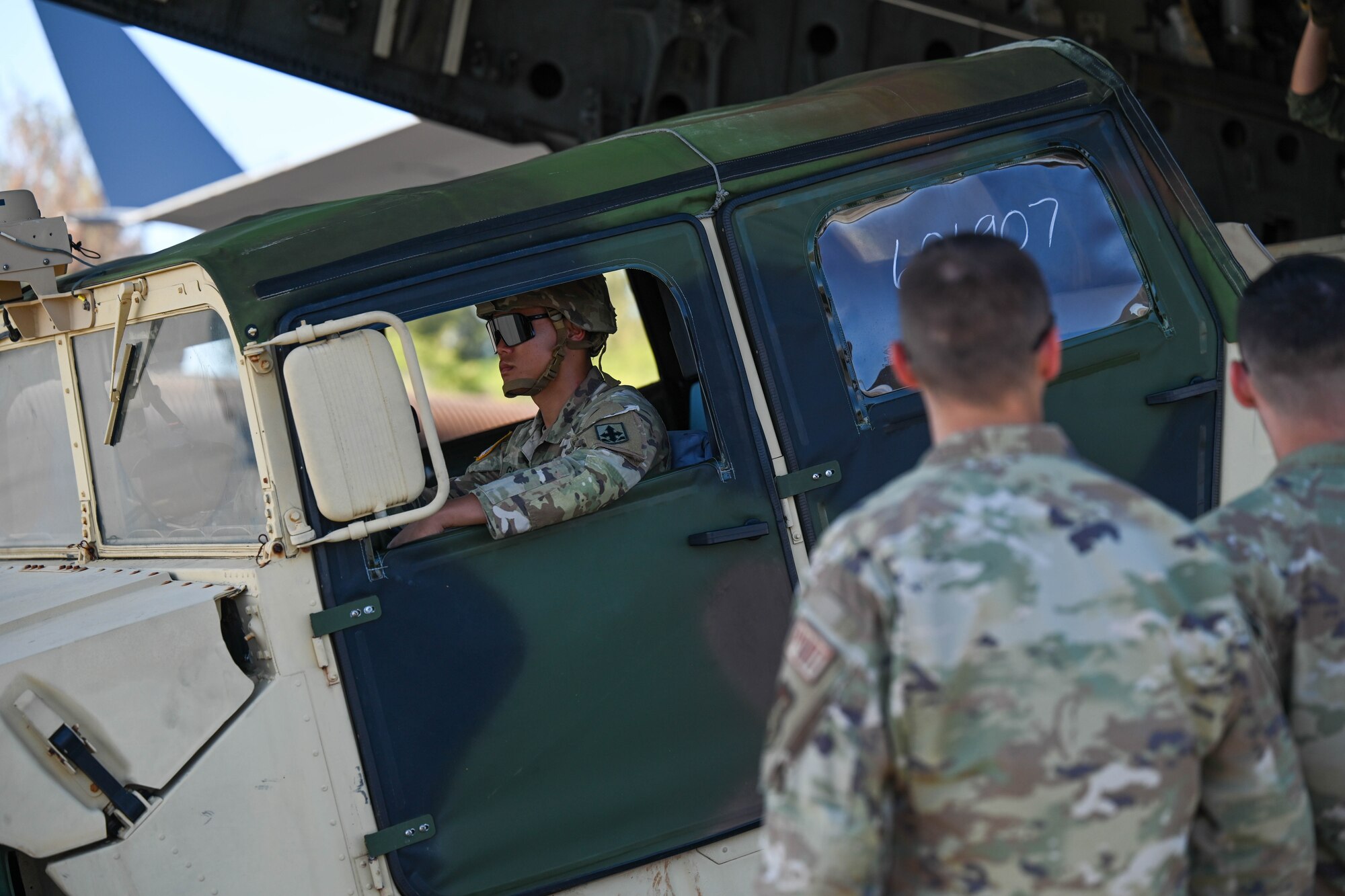 A U.S. Army Soldier assigned to the 524th Division Sustainment Support Battalion unloads a water buffalo off a C-17 Globemaster III in support of Joint Task Force 50 at Kahului Airport, Maui, Hawaii, August 19, 2023. Members from the 535th Airlift Squadron transported personnel and equipment from the U.S. Army in support of Joint Task Force 50 to provide humanitarian aid and assistance and offer continued support to the communities impacted by the wildfires. (U.S. Air Force photo by Senior Airman Makensie Cooper)