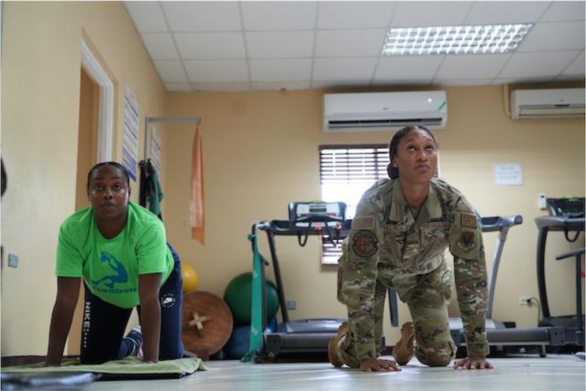 Senior Airman Oshin Mullings, a physical therapy technician with the 633rd Operational Medical Readiness Squadron at Langley Air Force Base, Va., demonstrates physical therapy techniques alongside a Jamaican soldier as part of a collaborative healthcare visit at the Jamaica Defense Forces Medical Center in Kingston. This Embedded Health Engagement Team shared best practices to help boost Jamaica’s military medical readiness, strengthening relationships and building trust with this U. S. partner in the Caribbean.