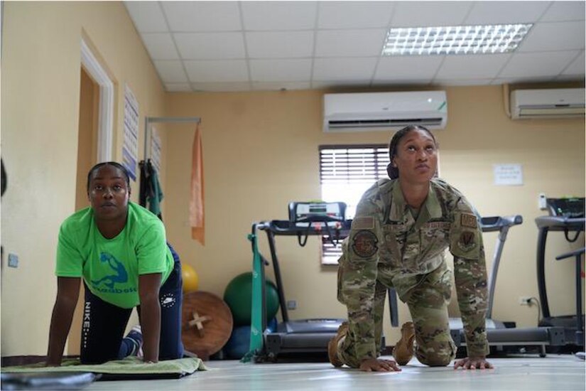 Senior Airman Oshin Mullings, a physical therapy technician with the 633rd Operational Medical Readiness Squadron at Langley Air Force Base, Va., demonstrates physical therapy techniques alongside a Jamaican soldier as part of a collaborative healthcare visit at the Jamaica Defense Forces Medical Center in Kingston. This Embedded Health Engagement Team shared best practices to help boost Jamaica’s military medical readiness, strengthening relationships and building trust with this U. S. partner in the Caribbean.
