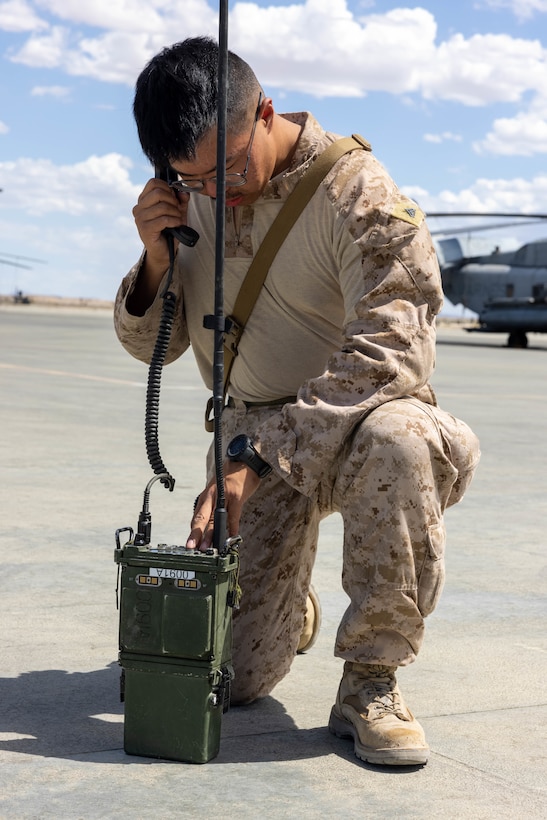 U.S. Marine Corps Cpl. Benson Yu, a radio operator with 3rd Low Altitude Air Defense Battalion, Marine Air Control Group 38, 3rd Marine Aircraft Wing, conducts an operations test on a Mobile User Objective System for movement to a forward arming and refueling point during Marine Air-Ground Task Force Training Command Distributed Maneuver (MDMX) exercise on Marine Corps Air-Ground Combat Center, Twentynine Palms, California Aug. 14, 2023.