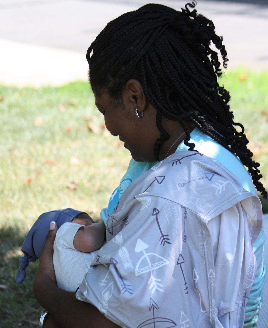 Mother breastfeeding son.