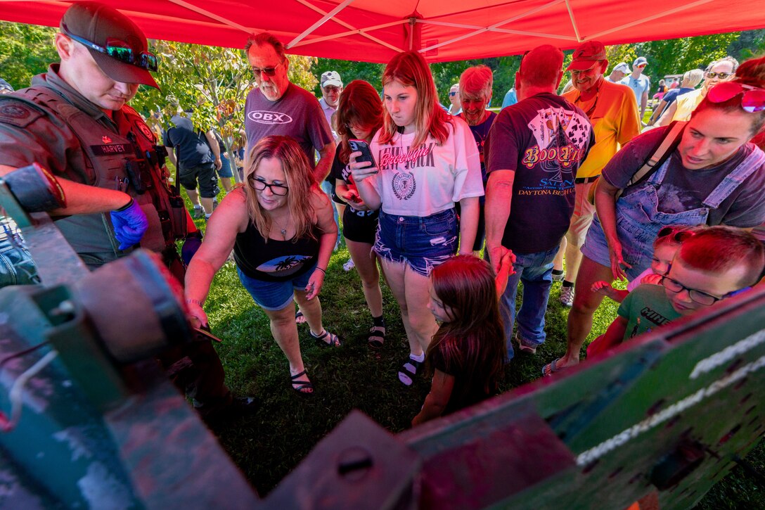 The Pennsylvania Game Commission invited event participants to take pictures with a sedated black bear brought to Youghiogheny River Lake’s 75th celebration in Confluence, Pennsylvania on Aug. 19, 2023.