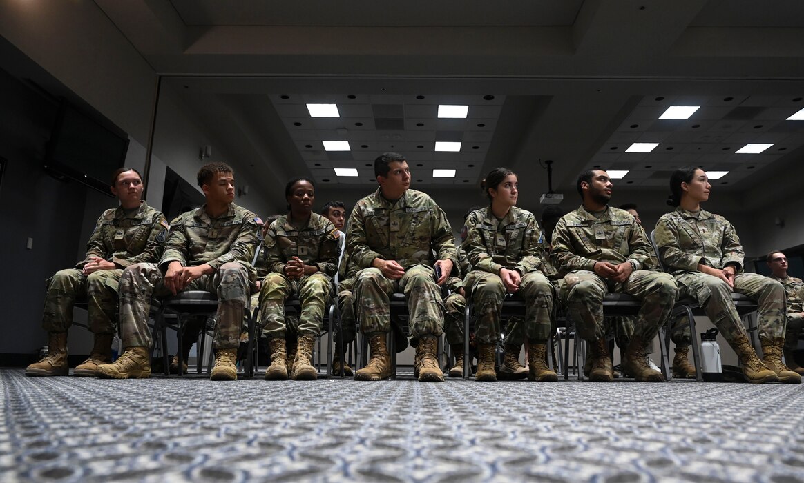 U.S. Space Force Guardians wait to receive their graduation certificates during the Space Intelligence Fundamentals graduation at the Powell Event Center, Goodfellow Air Force Base, Texas, Aug. 22, 2023. The SIF program directive created a “bridge course” implemented for guardians as a component of the Space Training and Readiness Command's vision of progression to enter Phase 1 of STARCOM's transformative roadmap of guardian training. (U.S. Air Force photo by Airman 1st Class Madison Collier)