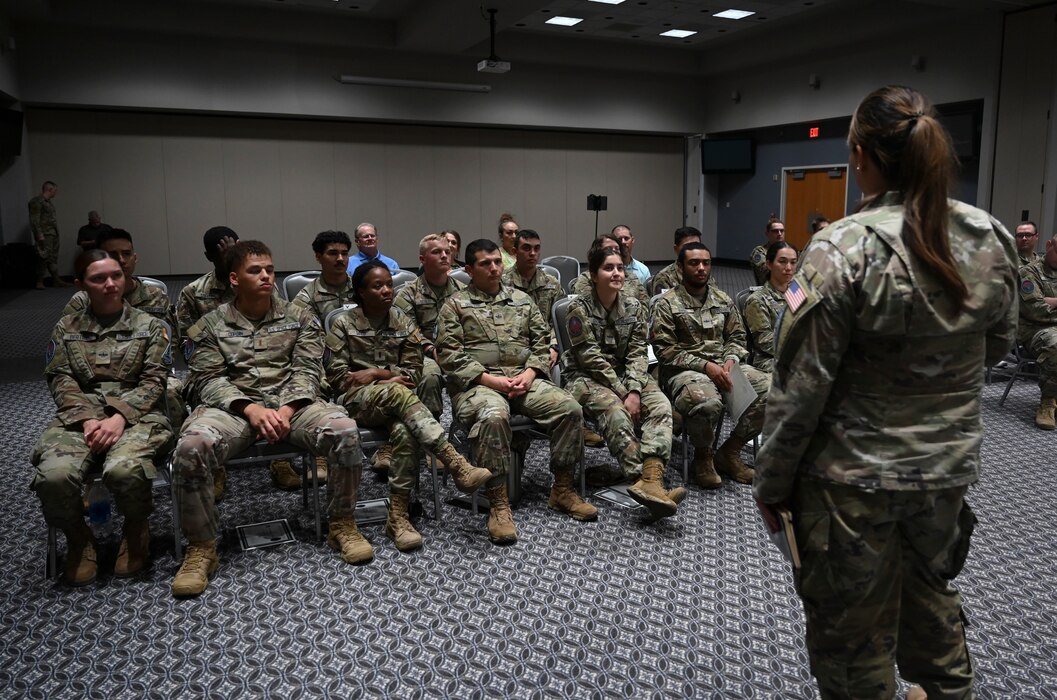 U.S. Space Force Lt. Col. Michelle Saffold, 71st Intelligence, Surveillance, and Reconnaissance Squadron commander, talks to graduates about their careers moving forward into operational environments during the Space Intelligence Fundamentals graduation at the Powell Event Center, Goodfellow Air Force Base, Texas, Aug. 22, 2023. Students learned the importance of teamwork, initiative and leadership alongside the technical aspects of intelligence in the space domain. (U.S. Air Force photo by Airman 1st Class Madison Collier)
