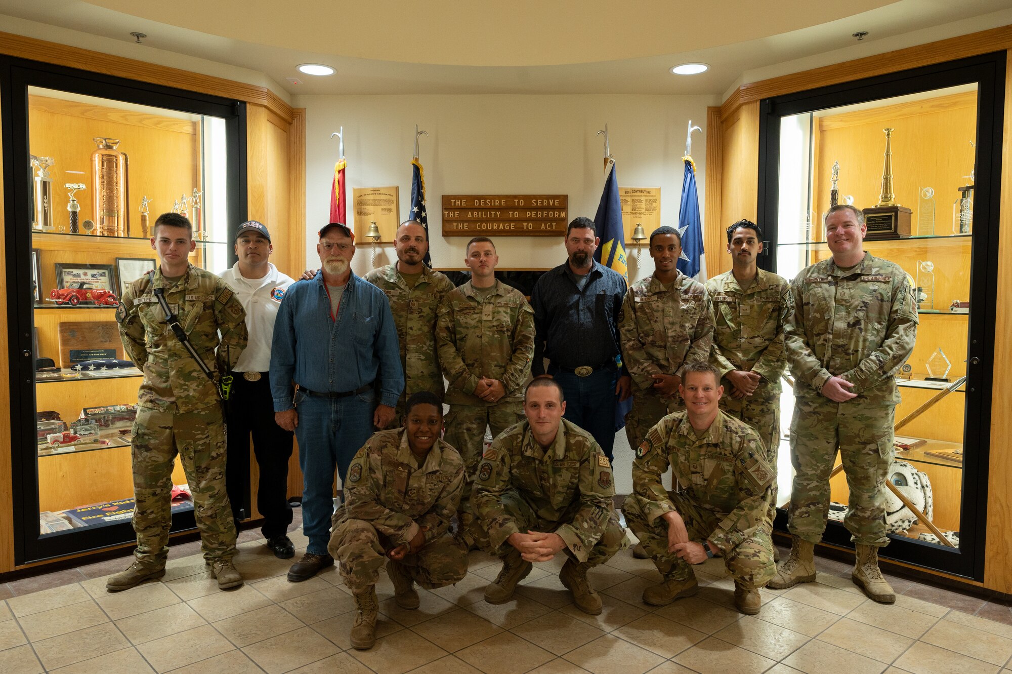 Members from the 7th Civil Engineer Squadron electrical and fire teams pose for a group photo at Dyess Air Force Base, Texas, Aug. 9, 2023. The group provided response after approximately three-fourths of military housing lost power after an electrical outage which later caused a fire. The 7th CES electrical and fire services exemplify their commitment to the safety and welfare of Dyess Airmen and their families by providing 24-hour support for emergencies and routine services.
