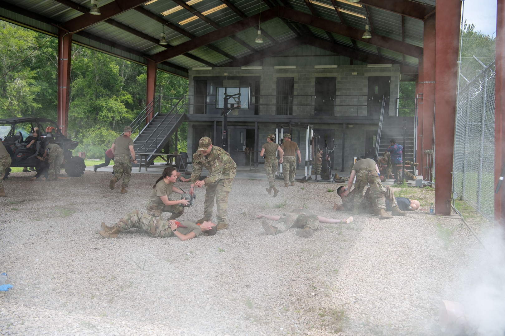 Airmen from the 138th Medical Group participate in a simulated combat environment as part of their final test in completing Tactical Combat Casualty Care (TCCC) Tier 2 in Perry, Fla., July 20, 2023. Smoke grenades and fake rounds were fired to simulate a deployed environment so Airmen could learn how to handle themselves and remain focused on the mission at hand – caring for personnel and casualties. (Oklahoma National Guard Photo by Airman 1st Class Addison Barnes)