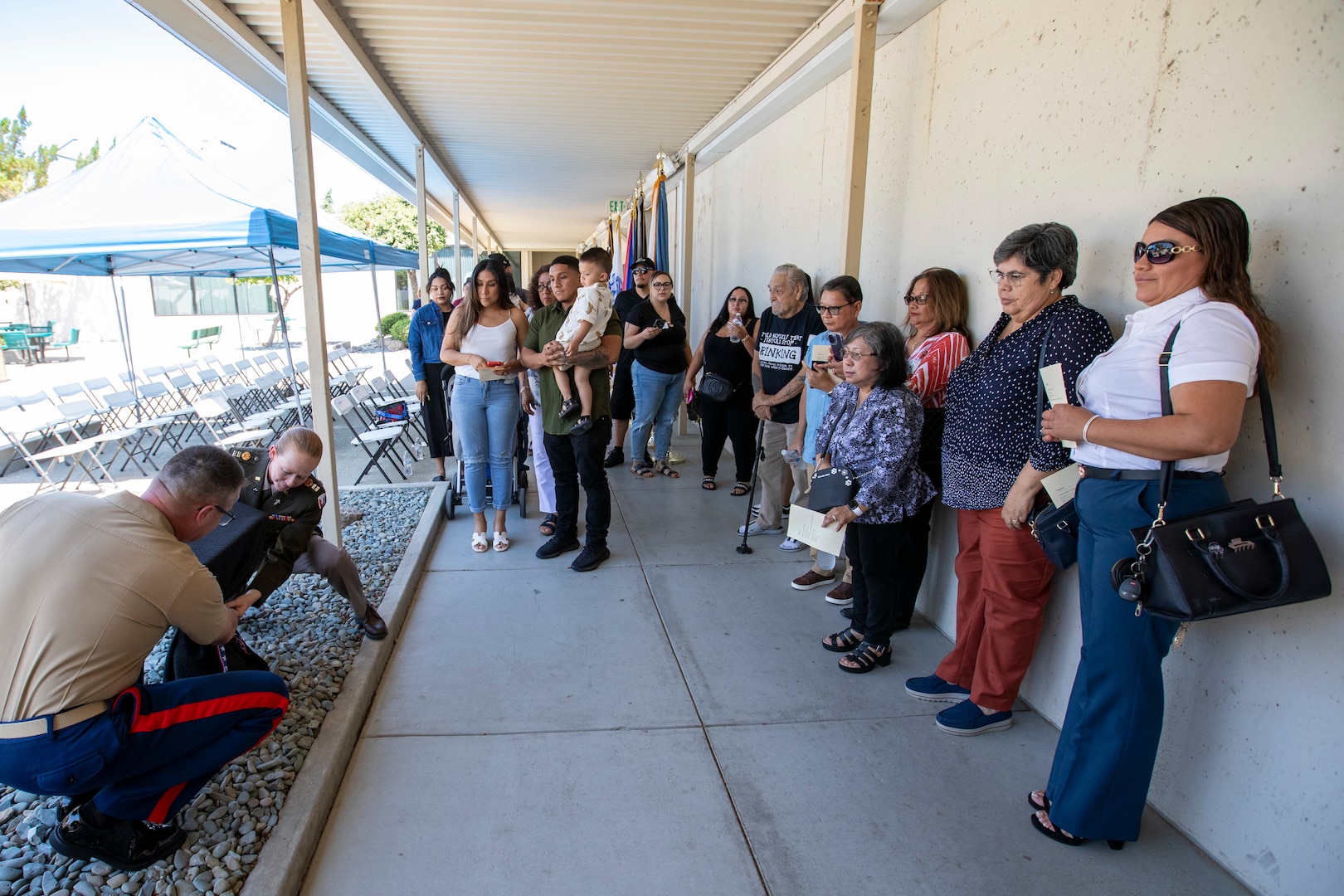 Marine Corps Col. Kevin Chunn, commander of DLA Distribution San Joaquin, California, and Chaplain, Army Capt. Terri Sykes unveil a monument during a ceremony dedicated to the families of the employees who lost their lives to the COVID pandemic on Aug. 18, 2023, at the DDJC installation. DLA photo by Julian Temblador.