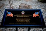 A monument dedicated to six employees who lost their lives to the COVID pandemic is unveiled during a a ceremony dedicated to the families of the employees who lost their lives to the COVID pandemic on Aug. 18, 2023, at the DLA Distribution San Joaquin, California, installation. DLA photo by Julian Temblador.