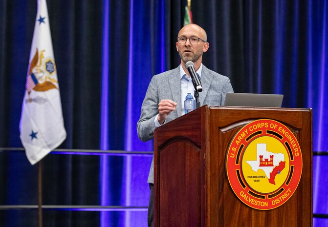 a person is standing at a podium talking