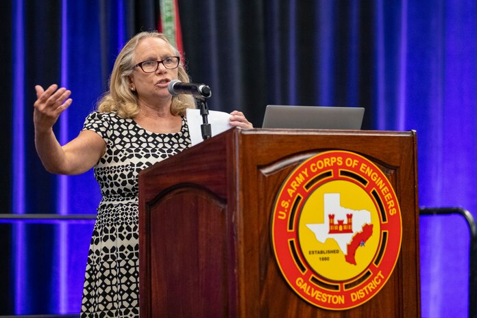 a person is standing at a podium talking
