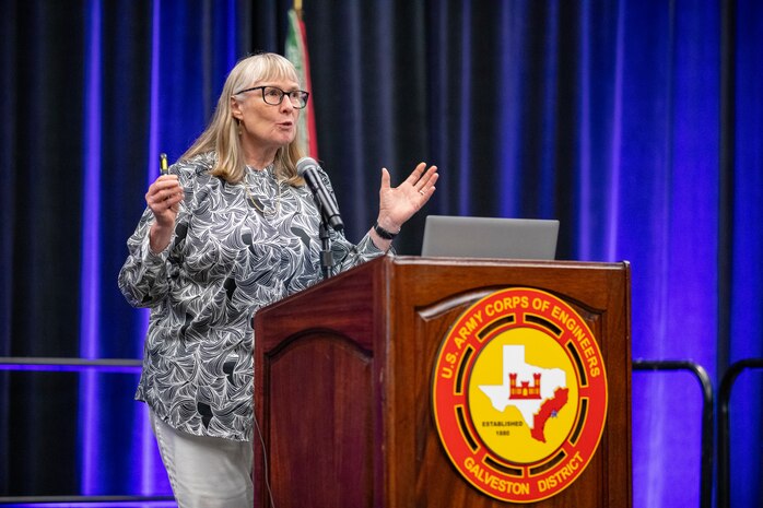 a person is standing at a podium talking