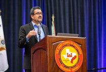 a person is standing at a podium talking
