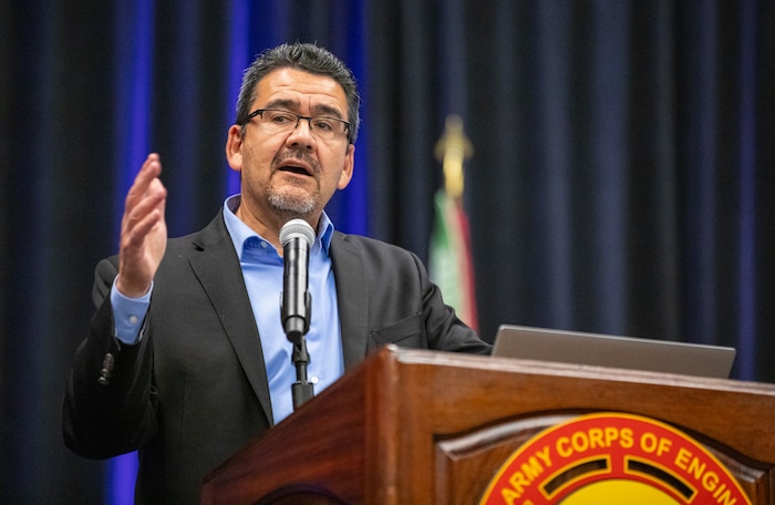 a person is standing at a podium talking