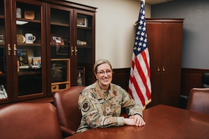 A women sits at a desk