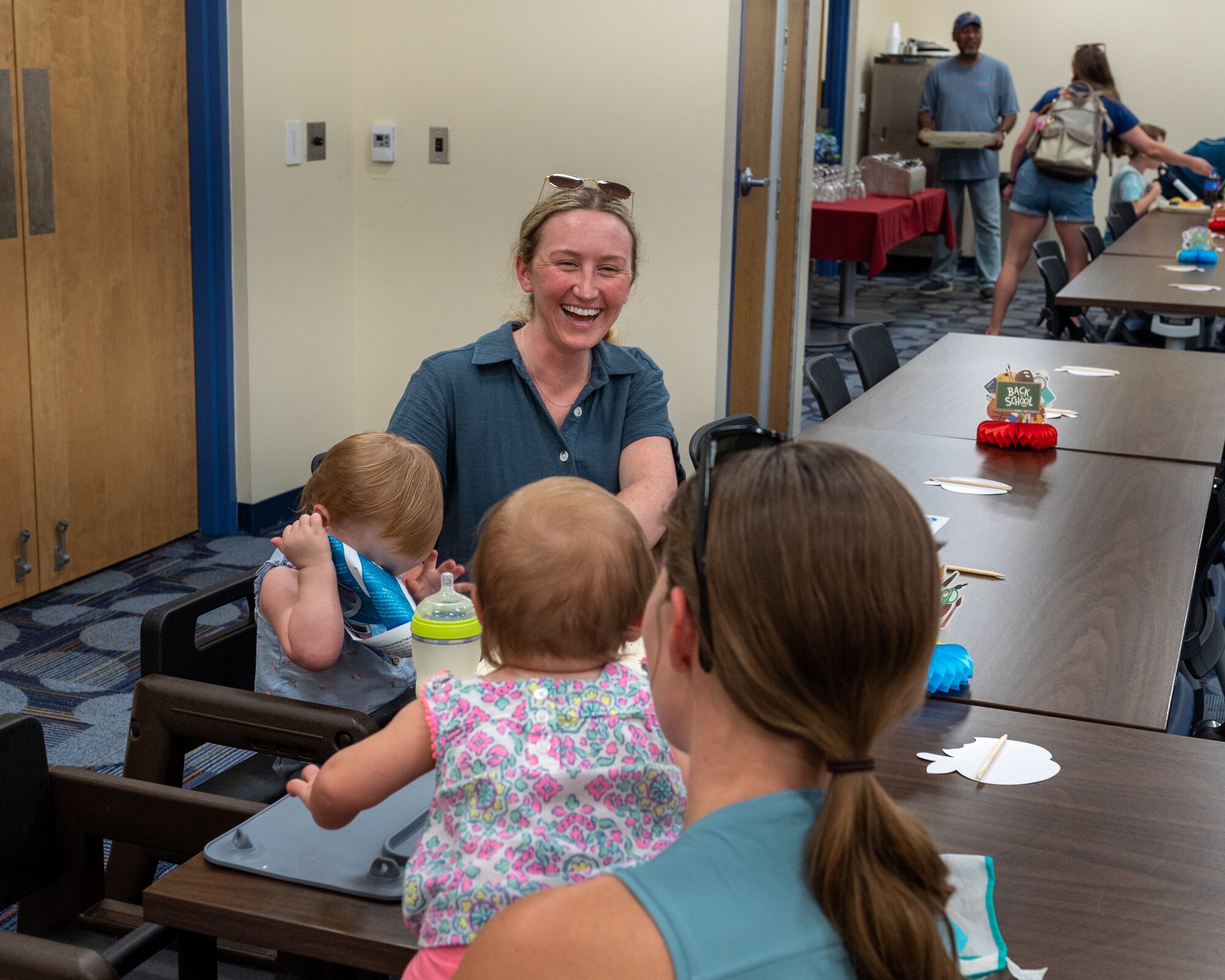 Military spouses and their kids had a great time at the Hearts Apart dinner at Moody Air Force Base, Georgia, Aug. 17, 2023. Events like these allow attendees to build friendships and help ease the stress and demands on families during deployment. (U.S. Air Force photo by Airman 1st Class Leonid Soubbotine)