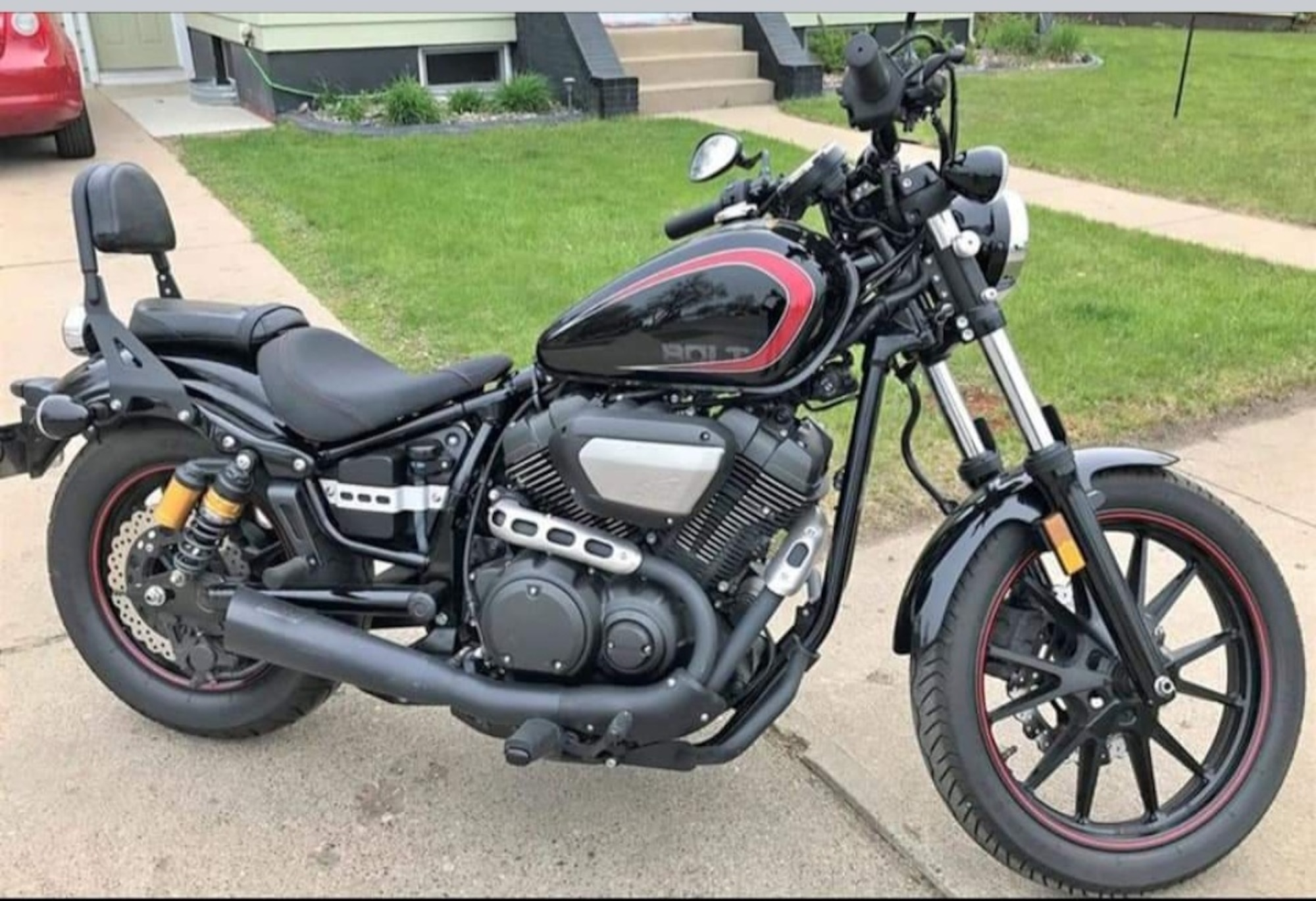 A motorcycle is parked on a driveway August 25, 2023, at Minot, North Dakota. This is the first motorcycle I ever owned, and the one I taught myself to drive. (U.S. Air Force photo by Senior Airman Caleb S. Kimmell)