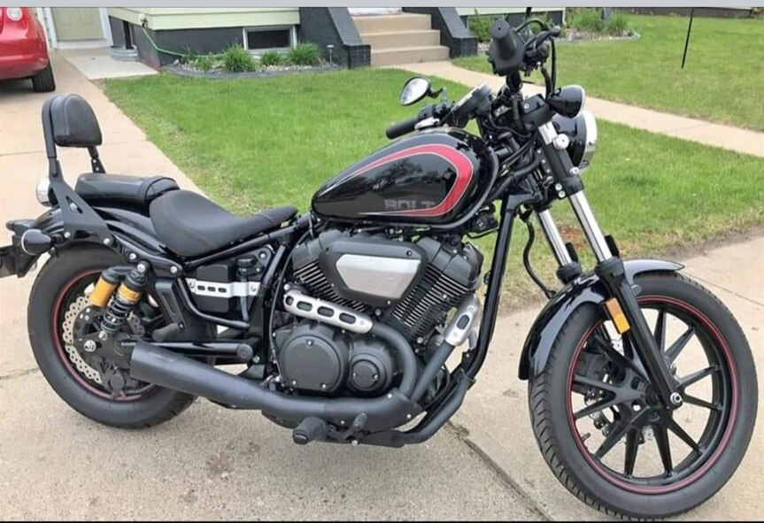 A motorcycle is parked on a driveway August 25, 2023, at Minot, North Dakota. This is the first motorcycle I ever owned, and the one I taught myself to drive. (U.S. Air Force photo by Senior Airman Caleb S. Kimmell)