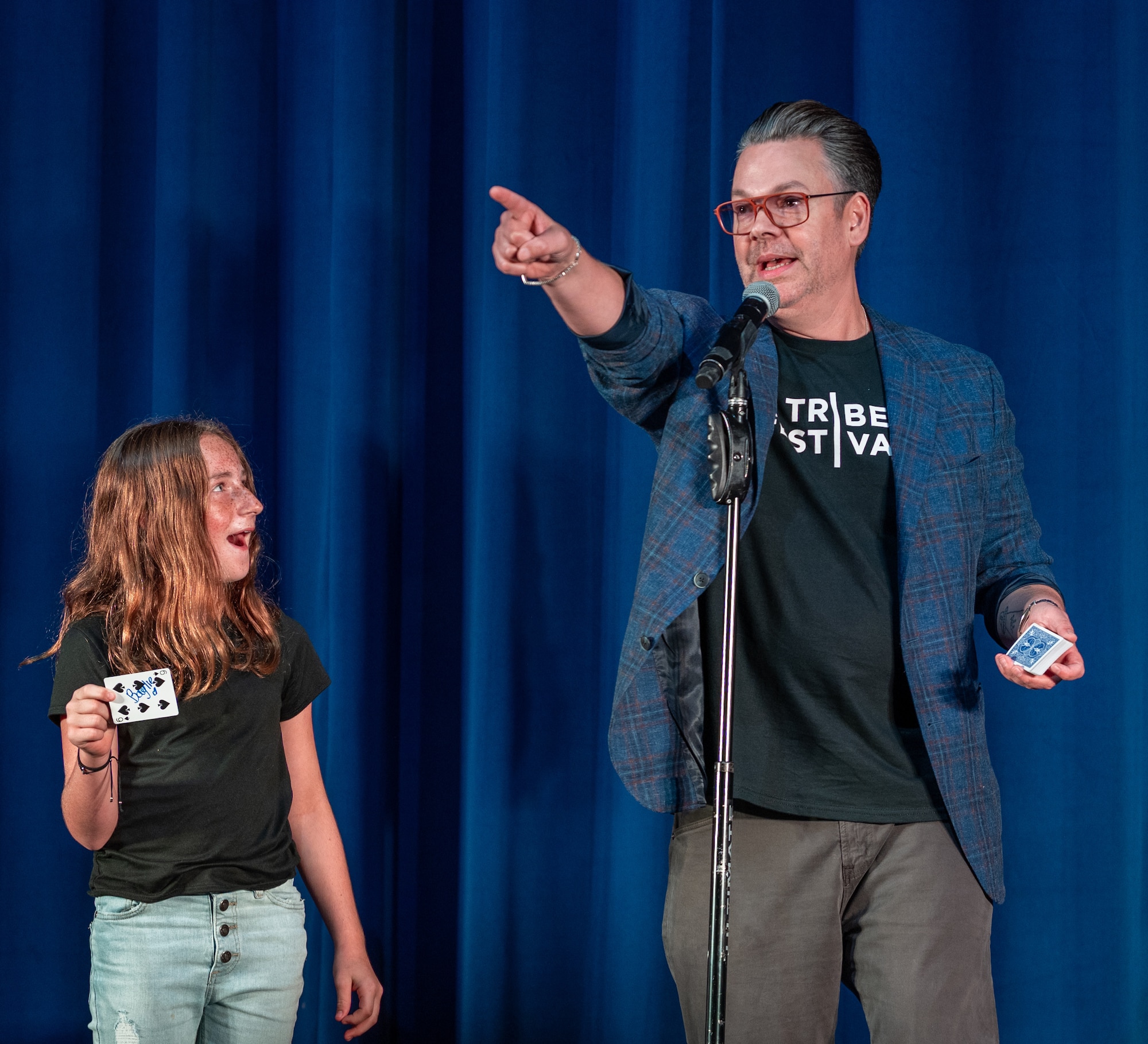 A young participant is awed by a magic trick performed by Derek Hughes, a comedian, during the Smash Up Comedy night at Moody Air Force Base, Georgia, Aug. 17, 2023. The Smash Up Comedy tour was an on-base family event which dazzled the audience with comedy, magic, and music. (U.S. Air Force photo by Airman 1st Class Leonid Soubbotine)