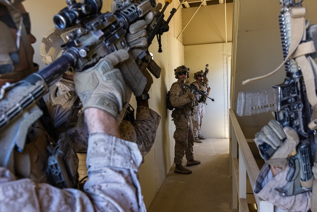 U.S. Marines with Kilo Company, 3rd Battalion, 7th Marine Regiment, secure a building during Adversary Force Exercise (AFX) 5-23 at Marine Corps Air-Ground Combat Center, Twentynine Palms, California, Aug. 7, 2023. AFX 5-23 tested the skills of Marines in seizing and maintaining a combat presence in urban environments by practicing offensive and defensive tactics, conducing logistics in a contested environment, and utilizing mechanized infantry. (U.S. Marine Corps photo by Cpl. Jonathan Willcox)