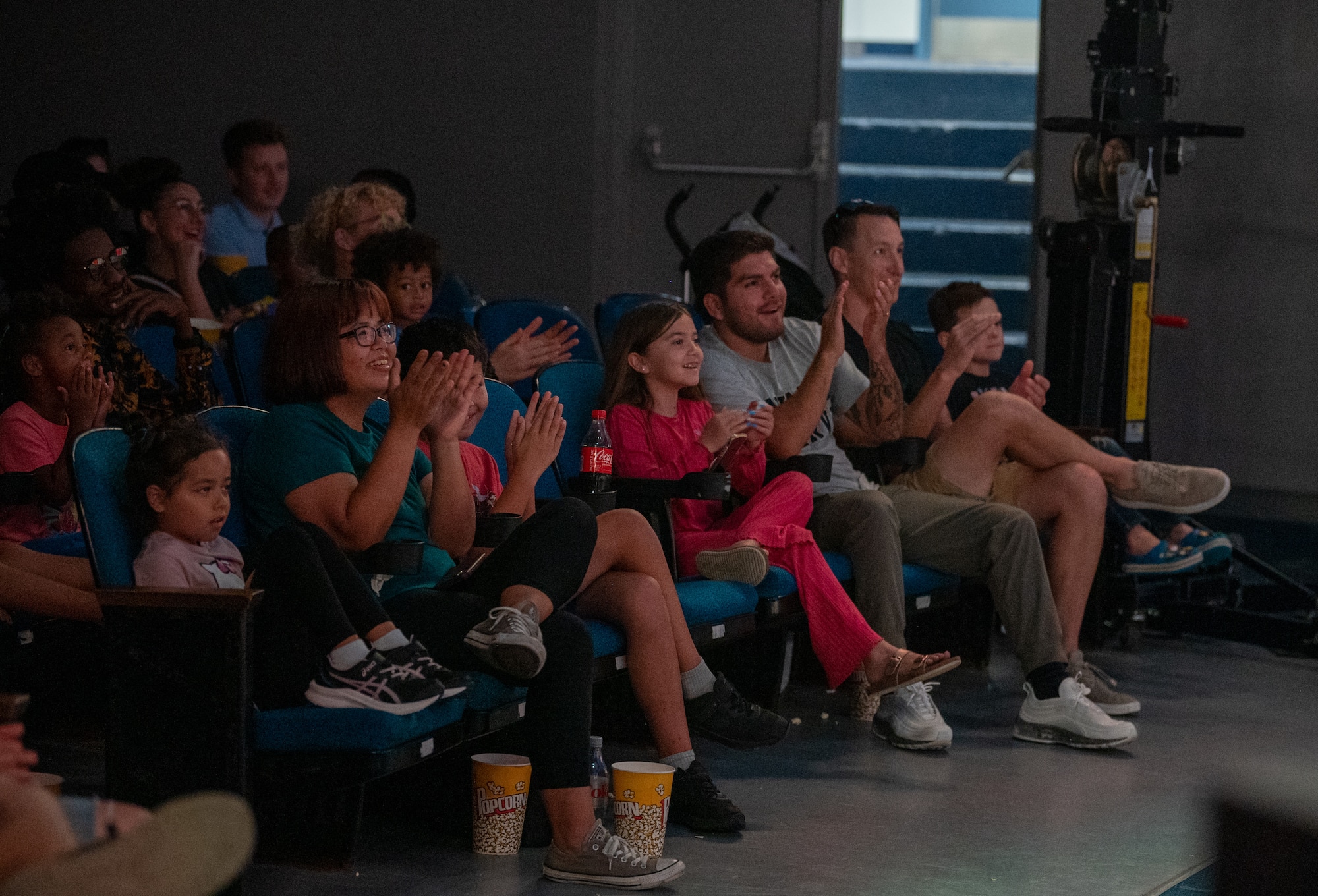 A crowd cheers for the performer during the Smash Up Comedy night at Moody Air Force Base, Georgia, Aug. 17, 2023. The Smash Up Comedy tour was an on-base family event which dazzled the audience with comedy, magic, and music. (U.S. Air Force photo by Airman 1st Class Leonid Soubbotine)