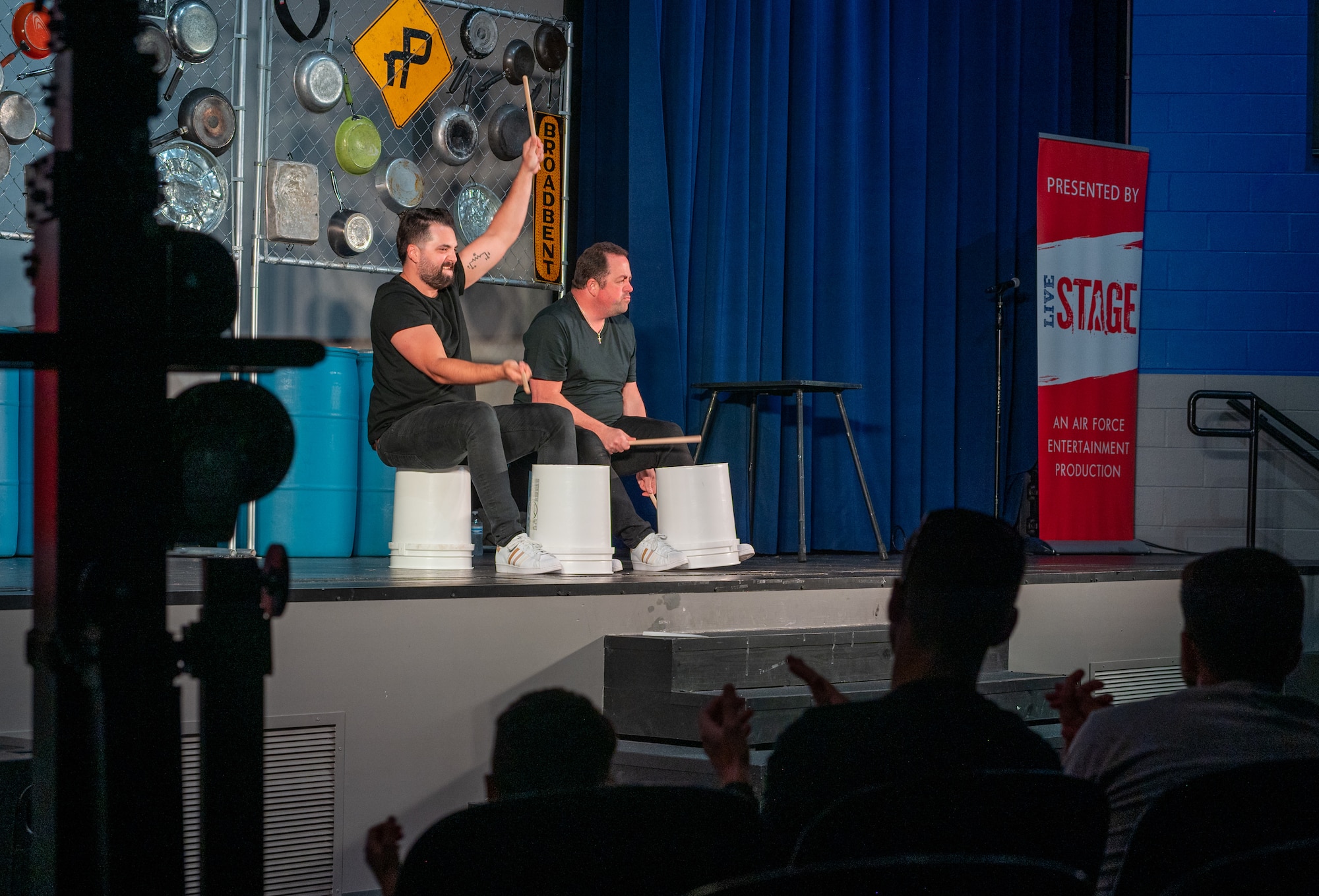 The band rePercussion uses buckets as a drum set during the Smash Up Comedy night at Moody Air Force Base, Georgia, Aug. 17, 2023. The Smash Up Comedy tour was an on-base family event which dazzled the audience with comedy, magic, and music. (U.S. Air Force photo by Airman 1st Class Leonid Soubbotine)