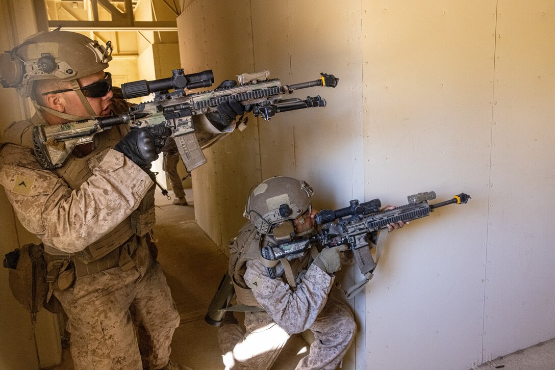 U.S. Marines with Kilo Company, 3rd Battalion, 7th Marine Regiment, secure a building during Adversary Force Exercise (AFX) 5-23 at Marine Corps Air-Ground Combat Center, Twentynine Palms, California, Aug. 7, 2023. AFX 5-23 tested the skills of Marines in seizing and maintaining a combat presence in urban environments by practicing offensive and defensive tactics, conducing logistics in a contested environment, and utilizing mechanized infantry. (U.S. Marine Corps photo by Cpl. Jonathan Willcox)